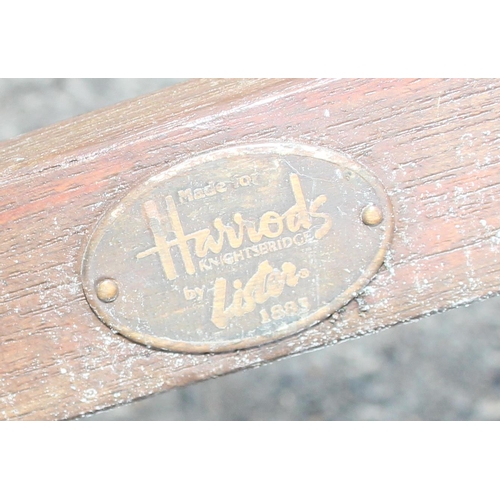 345 - A large hardwood garden table and 10 chairs, retailed by Harrods, table with 4 extensions to be squa... 