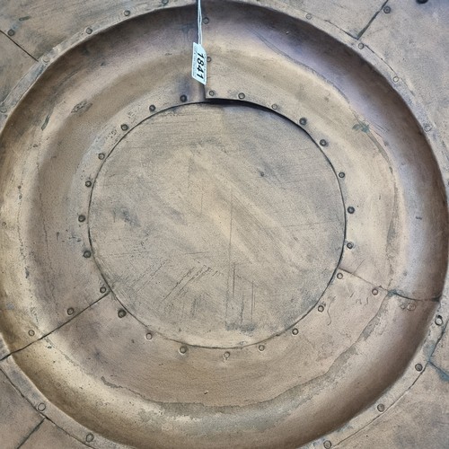 1841 - A large industrial style riveted copper wall charger, approx 80cm diameter