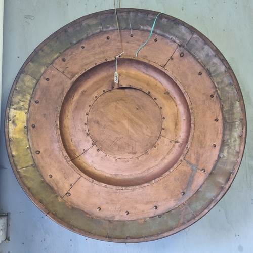 1841 - A large industrial style riveted copper wall charger, approx 80cm diameter