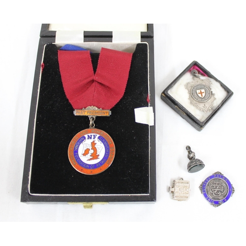 1012 - 3 silver and enamel fobs and medals, a silver bible charm and a small silver mounted letter seal, Bi... 