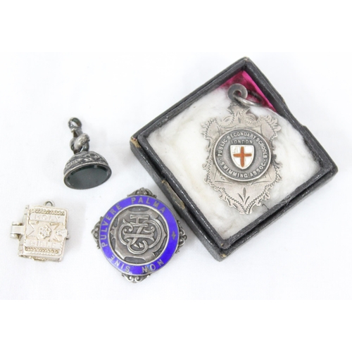 1012 - 3 silver and enamel fobs and medals, a silver bible charm and a small silver mounted letter seal, Bi... 