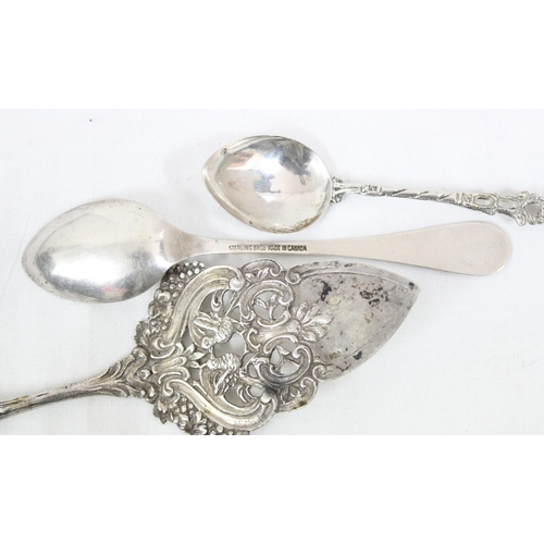 1014 - An 830 silver decorative cake slice, a similar 800 silver spoon and a Canadian silver and enamel spo... 