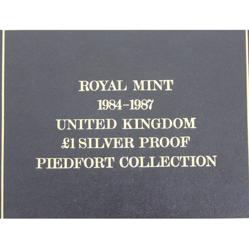 1214 - Royal Mint 1984-1987 United Kingdom £1 silver proof Piedfort Collection, 4 coin set in box with Roya... 