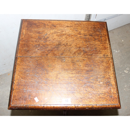 10 - A 19th century oak square table on tripod base, approx 53cm square