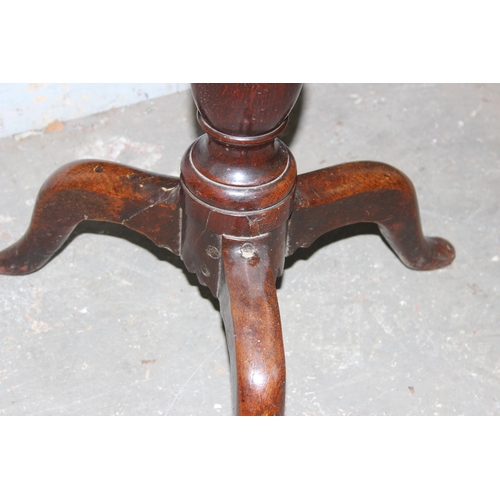 10 - A 19th century oak square table on tripod base, approx 53cm square