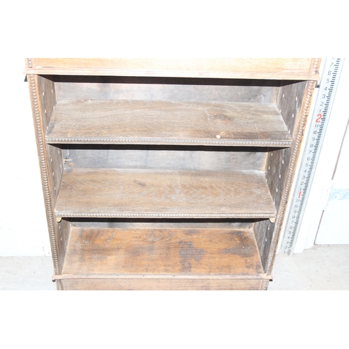 12 - A small vintage oak bookcase, approx 75cm wide