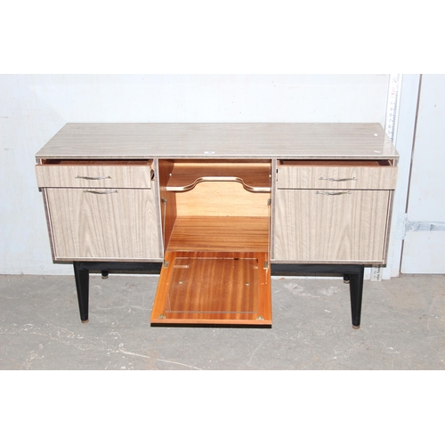 16 - A retro 1960's Formica 2 drawer 3 door sideboard, approx 137cm wide