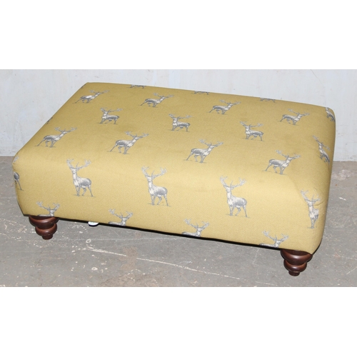 19 - A large stuffed footstool or ottoman with mustard coloured upholstery decorated with stags and 4 mat... 