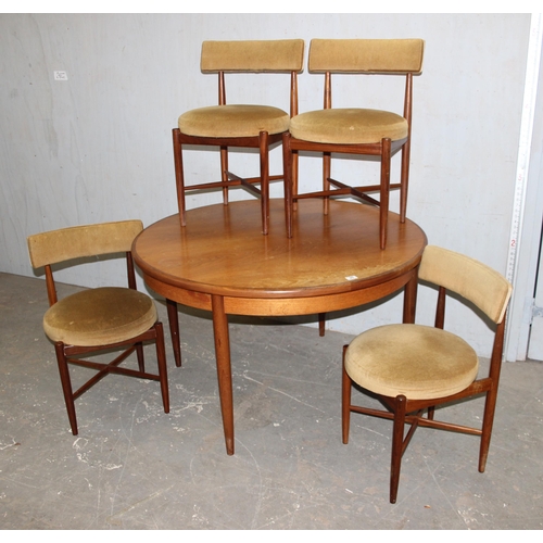 20 - A retro G-Plan teak extending round/ oval dining table and a set of 4 round seated bar backed chairs... 