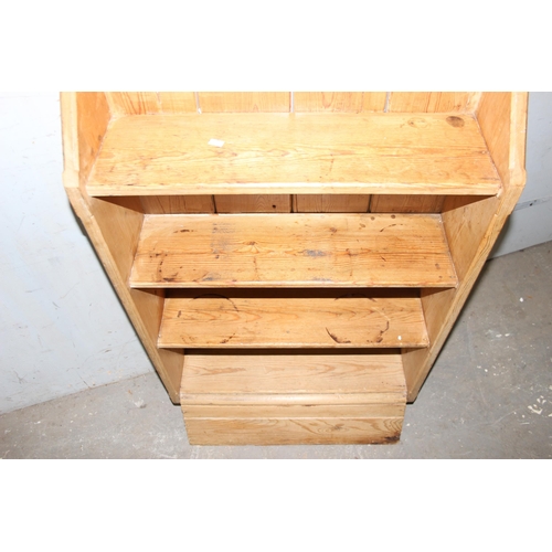 21 - A vintage pine bookcase, approx 61cm wide