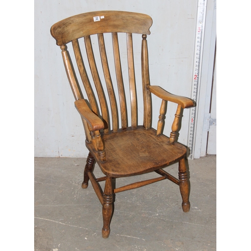 22 - A vintage Elm seated slatback farmhouse armchair