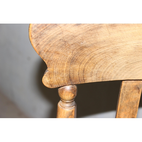 22 - A vintage Elm seated slatback farmhouse armchair