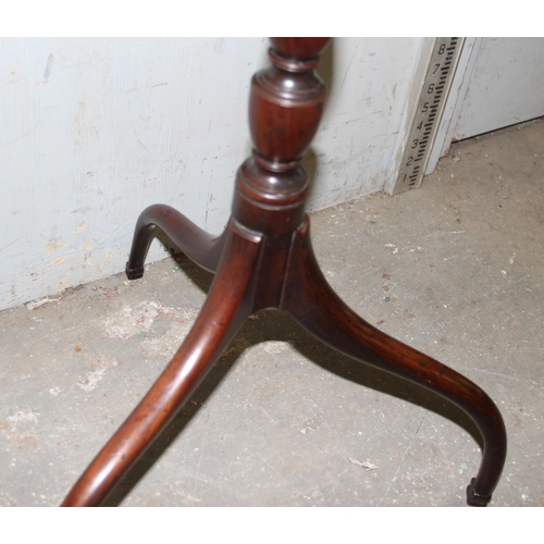 24 - An antique mahogany topped wine table with tripod base, approx 55cm wide