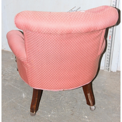 32 - An antique pink upholstered nursing chair with button back and turned legs