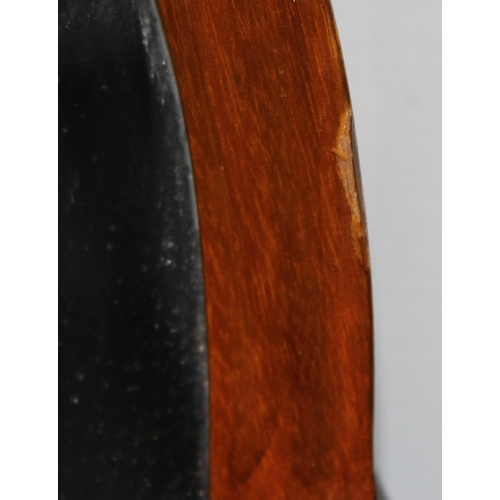 359 - A vintage cloud shaped walnut framed wall mirror with bevelled glass