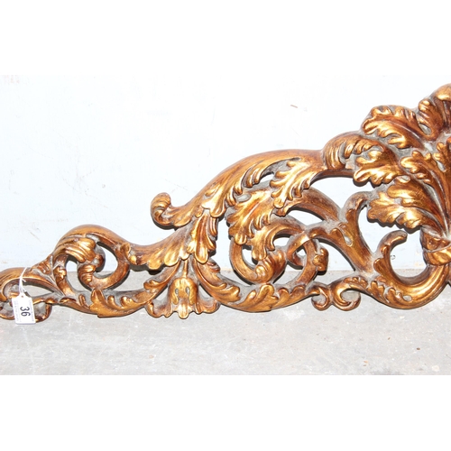 36 - A Rococo style gilt wall mounted pediment, approx 130cm wide