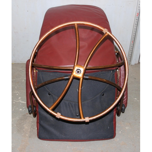 4 - A retro Scandinavian style red leather easy chair with copper finished metal base, no makers marks