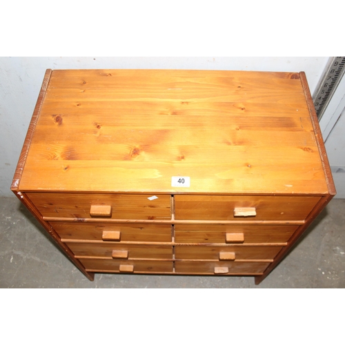 40 - A small modern 8 drawer wooden chest of drawers