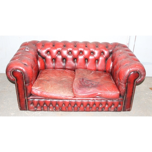 5 - A Chesterfield Ox-Blood red 2 seater button back sofa