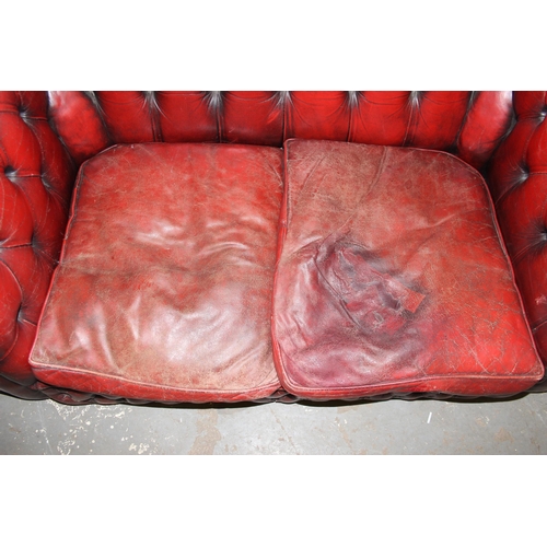 5 - A Chesterfield Ox-Blood red 2 seater button back sofa