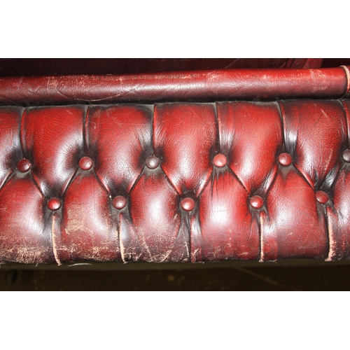 5 - A Chesterfield Ox-Blood red 2 seater button back sofa