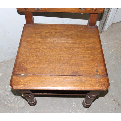 56 - A late 19th or early 20th century metamorphic oak library step chair in the Gothic revival taste, th... 