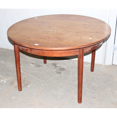 57 - A retro extending dining table by Dalescraft, approx 125cm in diameter