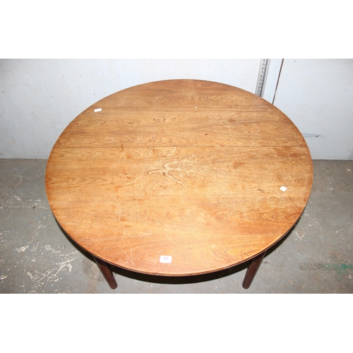 57 - A retro extending dining table by Dalescraft, approx 125cm in diameter