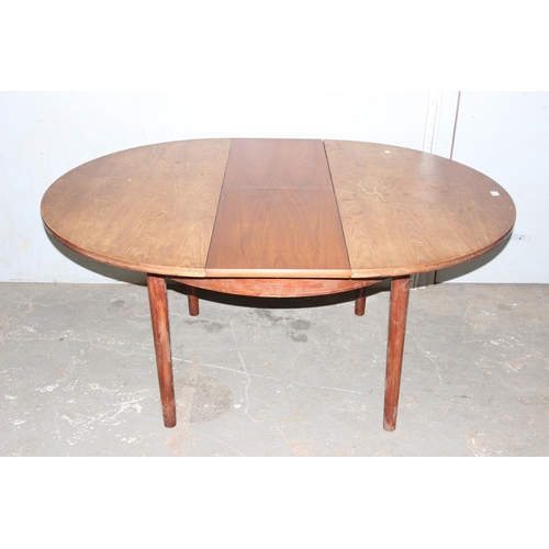 57 - A retro extending dining table by Dalescraft, approx 125cm in diameter