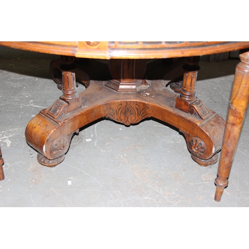 58 - An antique round dining table, likely Continental with impressive carved base and Greek Key carved f... 