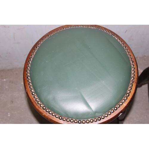 6 - A pair of vintage style green and studded topped stools by Warings Furniture of Norfolk