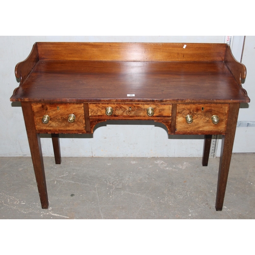 68 - An antique mahogany desk with fretwork gallery back and 3 drawers, approx 120cm wide