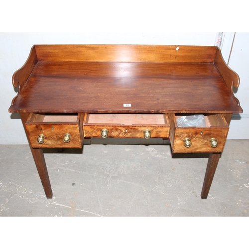 68 - An antique mahogany desk with fretwork gallery back and 3 drawers, approx 120cm wide