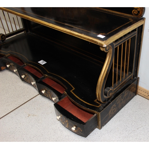 72 - A Regency period black japanned shelf with 5 small drawers and musical themed fretwork ends, approx ... 