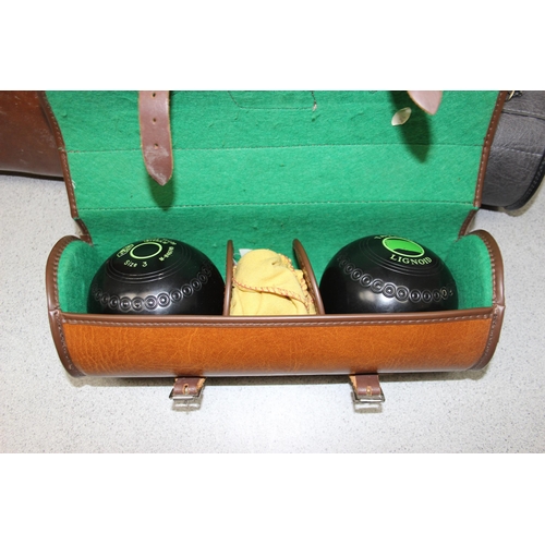 751 - A cased set of 4 and 2 cased pairs of bowls balls