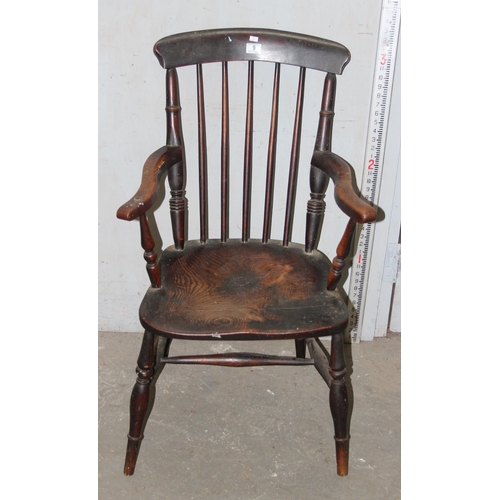 9 - An antique 19th century Elm seated stickback Windsor armchair