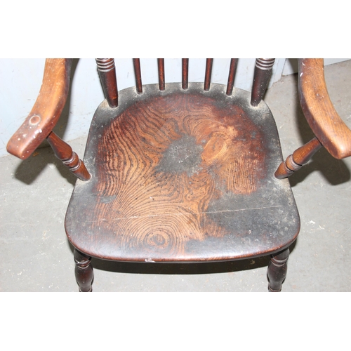 9 - An antique 19th century Elm seated stickback Windsor armchair