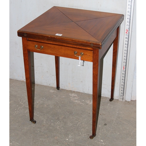 101 - An early 20th century Edwardian mahogany envelope card table