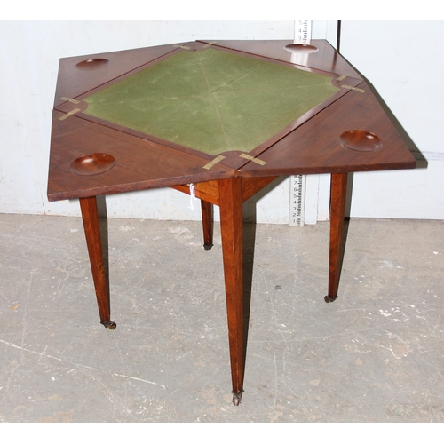 101 - An early 20th century Edwardian mahogany envelope card table