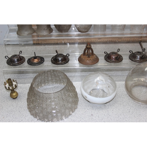 251 - A large qty of vintage oil lamp and other glass shades, chimneys and hangers