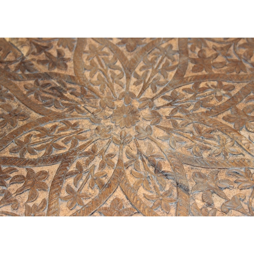 104 - An Indian carved hardwood octagonal table, approx 60cm wide