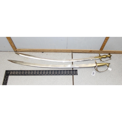 1421 - 2 20th century Indian Tulwar type swords with brass handles