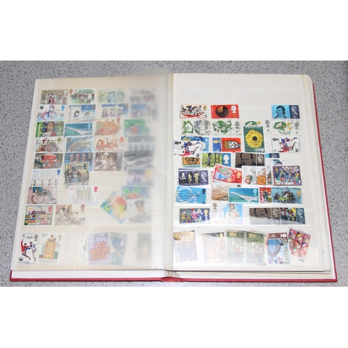 570 - 2 stamp albums with GB & foreign content and a folder of GB FDC's