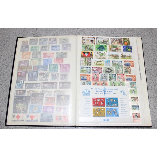 570 - 2 stamp albums with GB & foreign content and a folder of GB FDC's