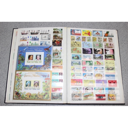 570 - 2 stamp albums with GB & foreign content and a folder of GB FDC's