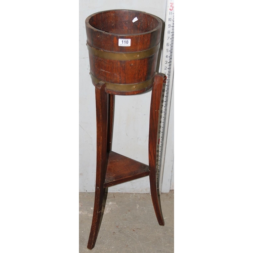 110 - An early 20th century coopered oak jardinière stand by Lister Wood Craft, approx 92cm tall