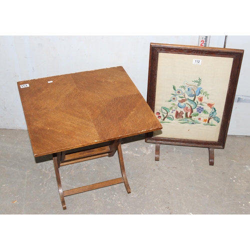 112 - A small folding table and a vintage embroidered fire screen