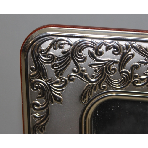 1023 - A large Italian silver plated table mirror and a silver plated photograph frame