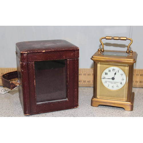 1336 - An antique carriage clock in leather travelling case, made in France but retailed by the Goldsmiths ... 