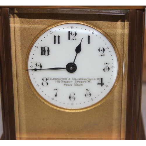 1336 - An antique carriage clock in leather travelling case, made in France but retailed by the Goldsmiths ... 